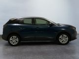 a picture of a blue car parked in a garage