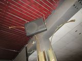 a suitcase hanging from the ceiling of a building
