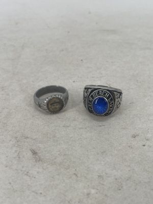 a couple of rings sitting on top of a white table