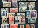 a lot of stamps that are on display on the wall