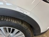 a close up of a car tire with a sticker on it