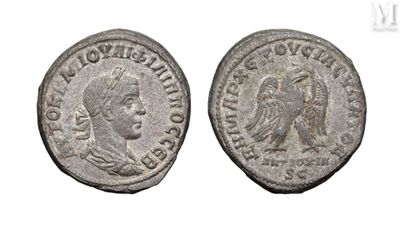 a silver coin with an image of a man and a woman on it