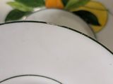 a close up of a plate with a flower on it