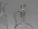two glass vases that are sitting next to each other