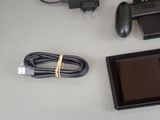 a picture of a video game system and accessories on a table