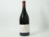 a bottle of wine that is sitting on a table
