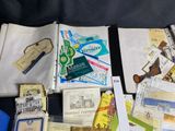 a lot of papers and other items that are on the table