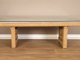 an image of a coffee table with a glass top on a wooden floor