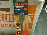 a pair of scissors sitting on top of a pile of boxes