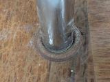 a close up of a metal object on a wooden table