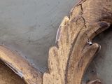 a close up of a decorative piece of wood on a wall