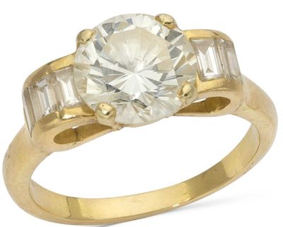 a close up of a diamond ring on a white background