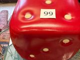a red box with polka dots on it sitting on a glass table
