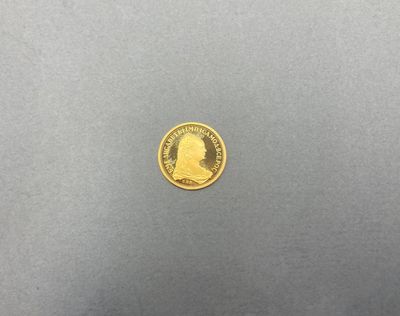 une pièce d'or sur laquelle est représentée la tête d'un homme