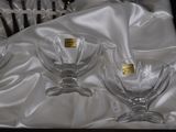 three empty wine glasses in a box on a table