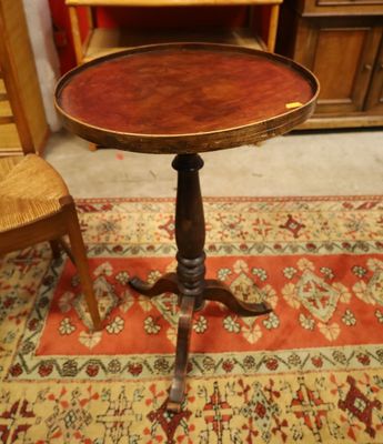 a small wooden table on a rug in a room