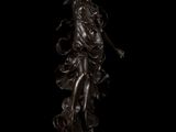 an image of a bronze statue of a woman holding a bird