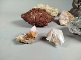many different types of rocks on a white surface