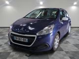 the small blue car is parked in a large room