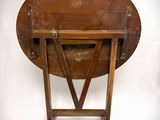 a small wooden table with a wooden top on a stand