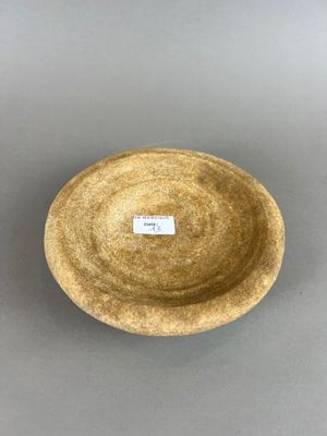 une image représentant un bol marron sur lequel figure une étiquette