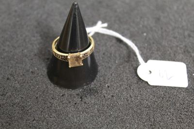 a close up of a ring with a tag attached to it
