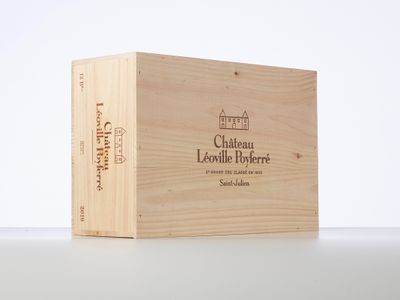 a wooden box with a label on it sitting on a table
