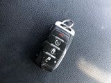 a car key sitting on top of a black leather seat