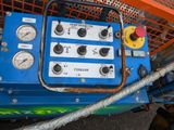 an image of a blue machine with gauges on it