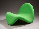 an image of a green chair sitting on top of a white floor