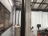 an image of a garage with a lot of work on it