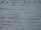 an old document with writing on it on a table