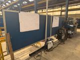 a picture of a room with a blue wall and a work bench
