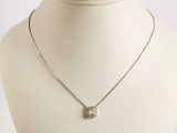 silver plated necklace with a square pendant on a mannequin neck