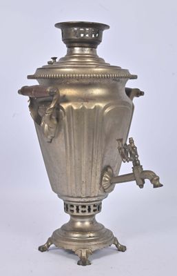 a silver urn with a handle on a white background