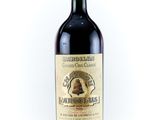 a bottle of red wine with a bell on it