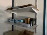 a shelf that has a lot of books on it