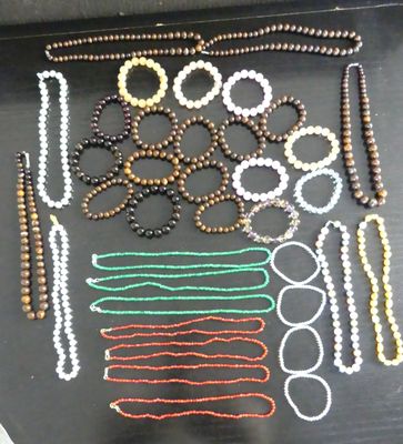 a tray with beads and scissors on it on a table