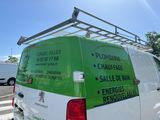 a van that is parked on the side of the road