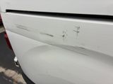 a white van with a hole in the side of it