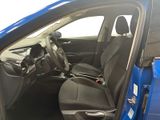 the interior of a blue car with the door open and the passenger seat down
