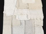 a close up of a bunch of white lace on a black surface