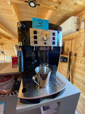 an image of a coffee machine on display in a room