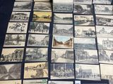 many old postcards of different types and sizes on a table