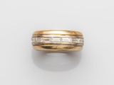 an 18k gold and diamond band ring