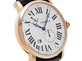 a close up of a wrist watch with roman numerals on it