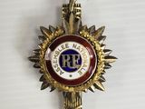a close up of a badge with a bird on top of it