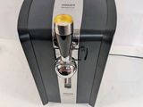 an image of a coffee machine sitting on top of a white table