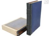 a book that is open and sitting next to a book