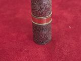 an image of a silver ring sitting on top of a red carpet